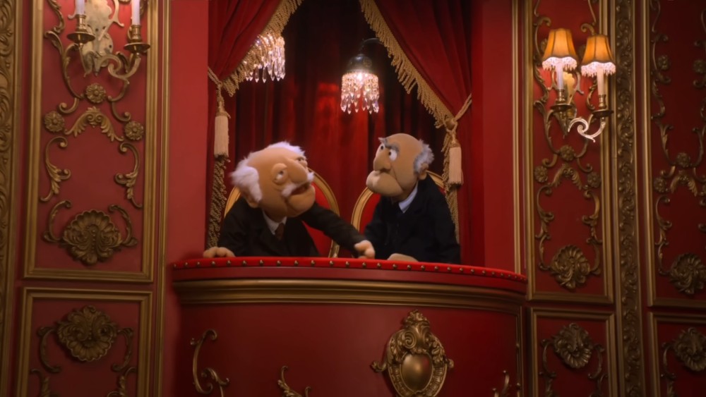 Statler and Waldorf in theater box from The Muppets