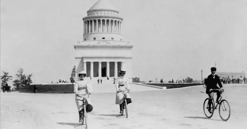 Vintage photo of women and man cycling in front of the Jefferson Memorial.